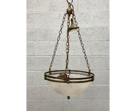 An early 20th century Art Deco plafonnier pendant light having a brass openwork surround suspended on three chains with a mou