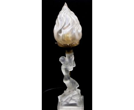 A frosted glass lamp shaped as a lady, holding the lamp, with brass fittings. Height approx 42cm.