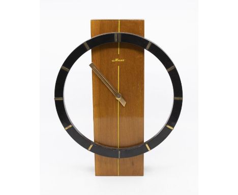 Modern mantel clock. An unusual design with simple veneered satin wood style rectangular centre. A black 8(1/2)" chapter ring