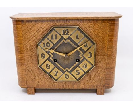 A H.A.C Arts & crafts style 8 day two train, spring driven mantle clock, contained in a lovely bright oak case, with octagona