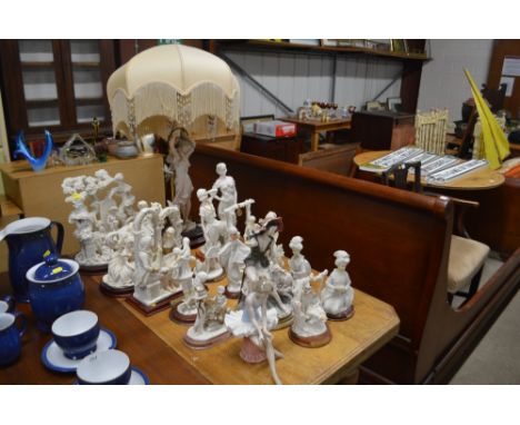 A collection of various decorative figures; and a table lamp and shade 