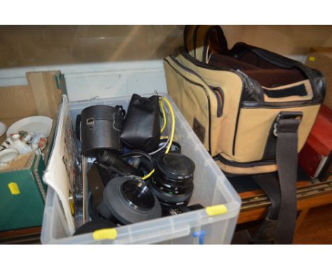 A box containing Mamiya 55mm lens; a Bronica 50mm lens and various other accessories and bag