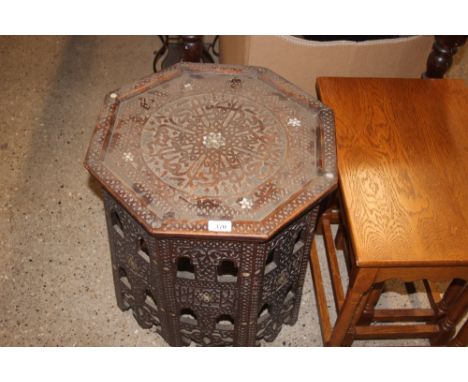 An Eastern octagonal topped and mother of pearl inlaid table 