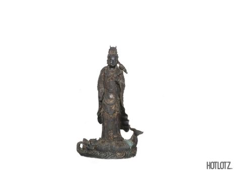 A LARGE CHINESE BRONZE STATUE OF GUANYIN
Standing, on a fish base
104cm high x 62cm wide x 30cm deep
Provenance: From the Col