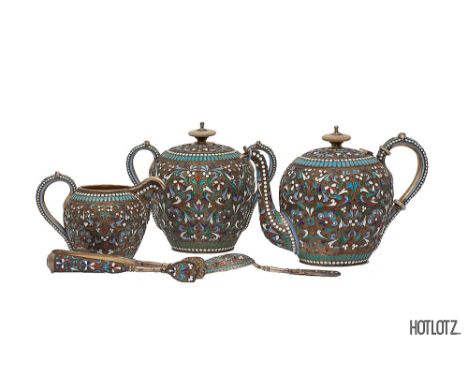 A RUSSIAN SILVER-GILT CLOISONNE ENAMEL FIVE PIECE TEA SERVICE.
Marked Ivan Saltykov, Moscow, 1896, Assay master Lev Fridrikho