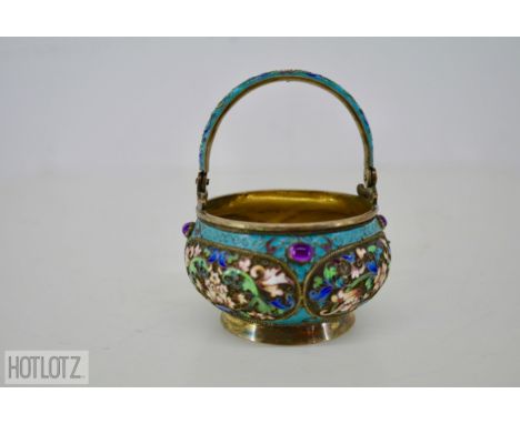 A RUSSIAN SILVER AND CLOISONNE ENAMEL BASKET
With swing handle, decorated in shaded enamels with scrolling foliage, gilt inte