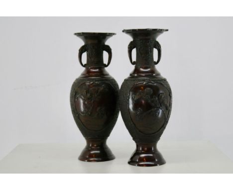 A PAIR OF ORIENTAL BRONZE VASES
Early 20th Century, Chinese/Japanese crossover, cast Chinese marks to base The barbed rim abo