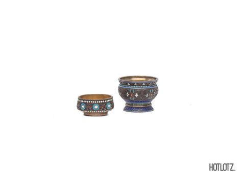 TWO RUSSIAN SILVER AND CLOISONNE ENAMEL SALTS
Decorated with stylised foliate and bead borders 3.9 cm high, 52 gr 2.1 cm high