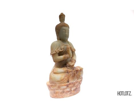 A LARGE CHINESE CARVED JADE BUDDHA
41cm high x 13cm deep x 21cm long
Provenance: From the Collection of Dato' Jannie Chan
Not