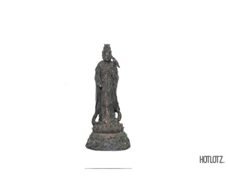 A LARGE CHINESE BRONZE STATUE OF GUANYIN
Standing on a lotus base
104cm high, 48cm diameter
Provenance: From the Collection o