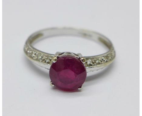 A 9ct gold, ruby solitaire ring with diamond set shoulders, 2.1g, Q 