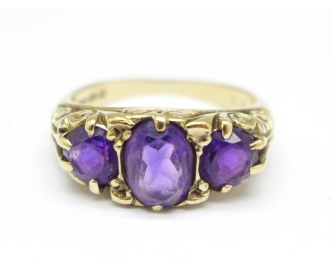 A 9ct gold and three stone amethyst ring, 4.4g, P 