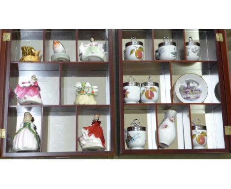 Two glass fronted display cabinets with Royal Doulton figures and Worcester egg coddlers 