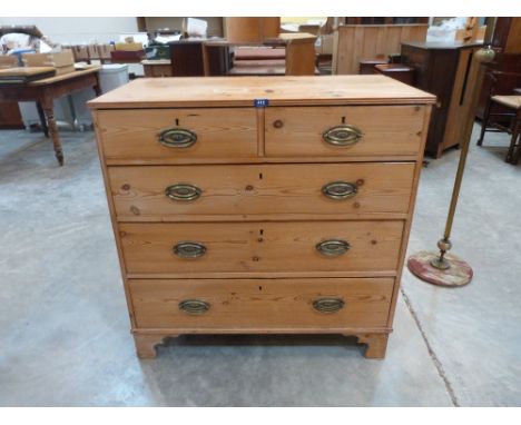 A 19th century pine chest of two short over three long drawers on bracket feet. 36' wide