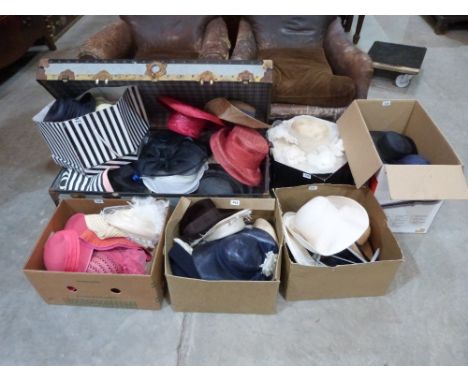 A large quantity of lady's hats, the lot to include a tin cabin trunk