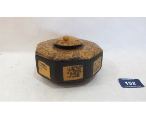 A Chinese carved treen octagonal inkwell. 4¼' diam
