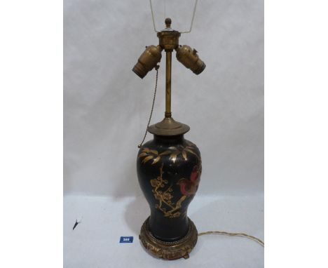 A Japanese ceramic table lamp on gilt metal base