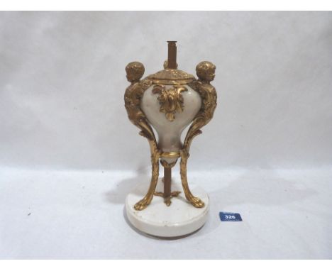 A marble and ormulu lamp base formed as an urn supported by three caryatids with paw feet. 11½' high