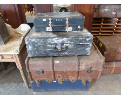 Three vintage cases and a cabin trunk