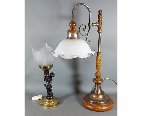 A Patinated metal lamp of figural form with glass shade, together with another table lamp 