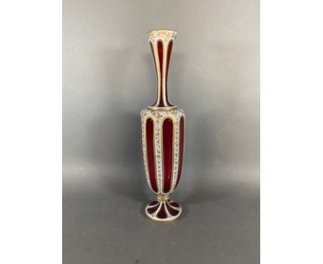 A Bohemian cameo glass vase highlighted with gilt upon ruby glass, 36cms tall 
