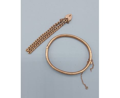 A 9ct gold bangle together with a 9ct gold linked bracelet with padlock clasp7.3 grams 