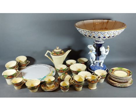 A Continental Large Table Centre with figural support, together with a Myott tea service and a bread board 