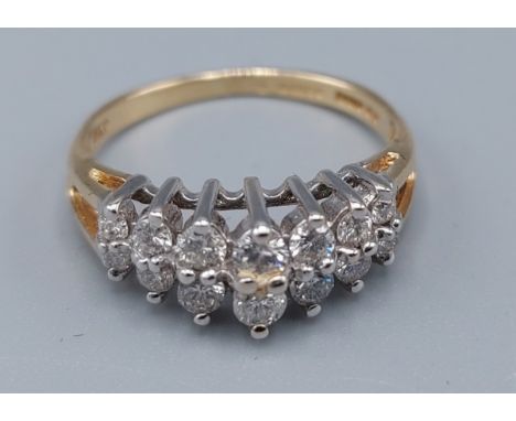 A 14ct gold ring set with two rows of graduated diamonds, 2.6 grams, ring size K 