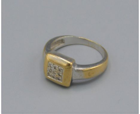 An 18ct gold diamond cluster ring, set with nine diamonds in a square setting, 5.2 grams, ring size K 