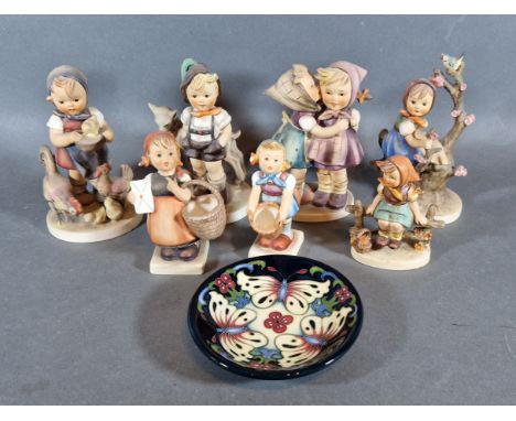 A collection of seven Goebels Hummel figures together with a Moorcroft small bowl 