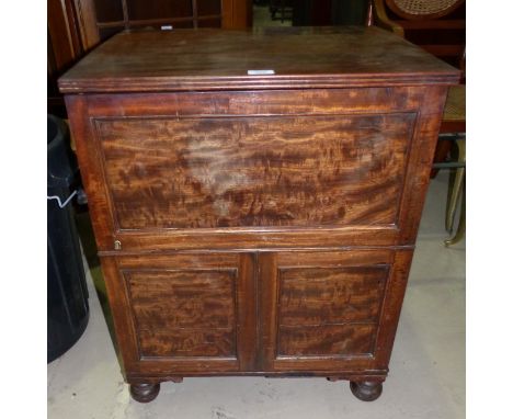 A Georgian mahogany cupboard converted from a commode