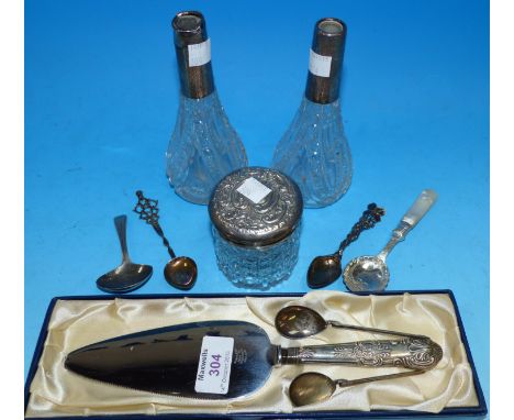 A Georgian caddy spoon; a silver handle pie slice; spoons; a silver top jar and 2 silver collar scent bottles (a.f.)