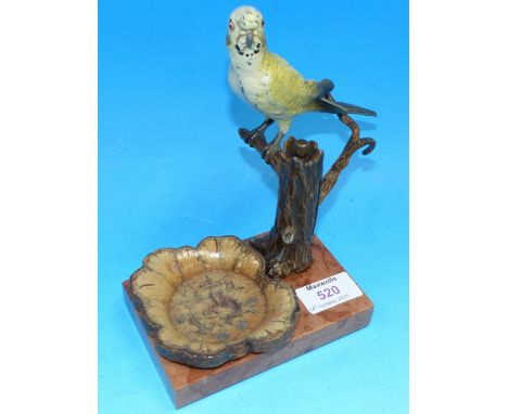 A c. 1930's table lighter in the form of a budgerigar perched on a tree stump on marble base, with ashtray and wand