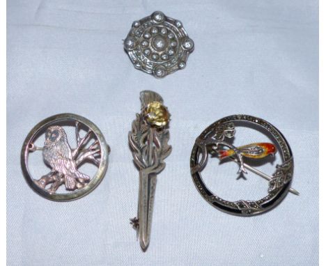 A 1930's marcasite and enamel bird on branch brooch; a Scottish silver dirk brooch; a silver owl brooch; an Iona silver Celti