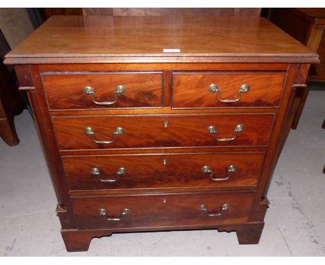 An antique mahogany bachelor's chest of 2 short and 3 long drawers, ogee bracket feet, 28" (with alterations)