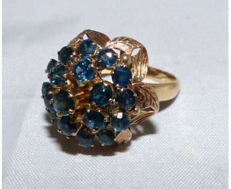 A 1970's cluster ring set blue stones, stamped '18K', gross weight 5.9 gm