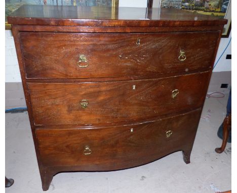 An early 19th century mahogany bow front chest of 3 long drawers with brass ring handles and splay bracket feet, width 37"