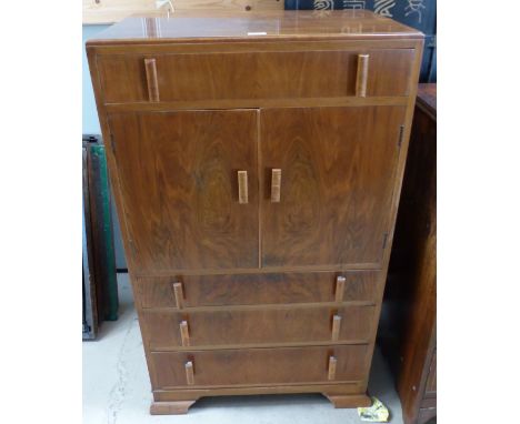 A 1930's walnut veneered tallboy cupboard