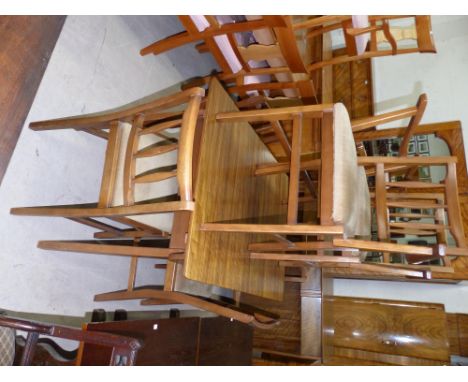 A 1950's walnut Gordon Russell style dining suite comprising extending dining table, 6 (4 + 2) chairs and sideboard