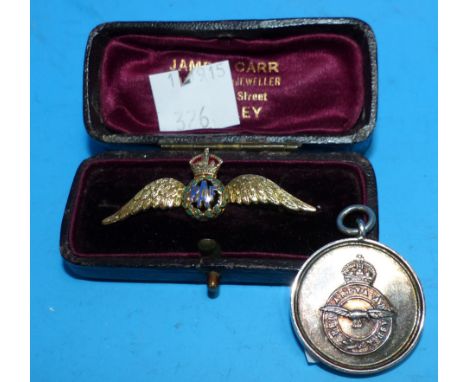 An RAF yellow metal and enamel bar brooch; an RAF medallion
