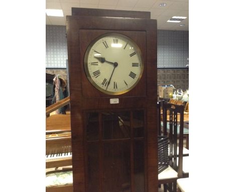 ART DECO LONGCASE CLOCKthe stepped top with circular enamel dial below with Roman numerals, contained in a walnut case with g