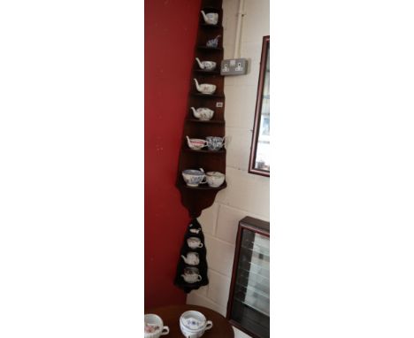 2 corner shelf units together with a collection of interesting invalid cups to include early examples