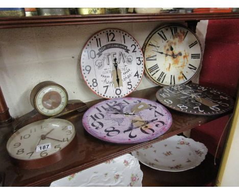 Shelf of novelty clocks