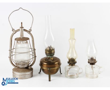 4x Period Oil Lamp Kerosene Burnes, to include a Vertas storm lantern 2 clear glass oil lamps, a brass lamp on tripod base, (