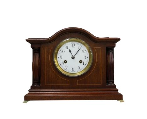 the numeral face and movement contained within a mahogany and boxwood inlaid case, raised on bracket feet