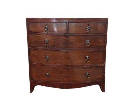 the inlaid and cross banded top resting on three long and two short graduated drawers, all raised on bracket feet, 105 cm wid