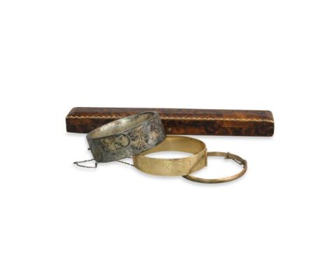 together with a silver bangle and a Weirs &amp; Sons box