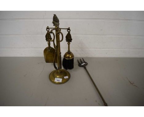 BRASS FIRE COMPANION SET AND A TOASTING FORK