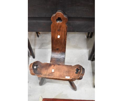 A 20th century birthing stool in Pine on tripod base