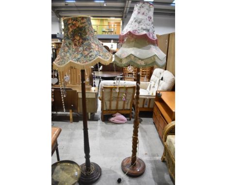 A traditional standard lamp having twist column and floral shade with Gypsy-esque additions